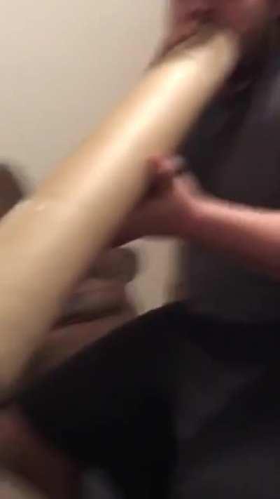 Guy inhaling his chinchilla through a straw