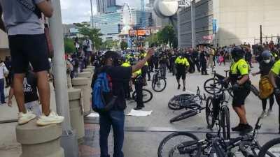 This is what turned a peaceful protest violent in Atlanta last Friday 5-29-20. A bike cop shoves his bike into a woman and then gets shoved on the ground by that woman. Bike cop then decides to spray mace into the crowd without warning after everything ha