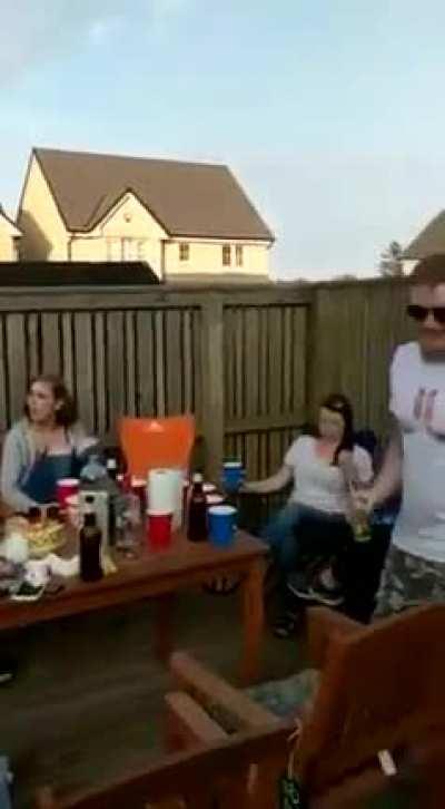 Guy purposely puts his balls on a moving bike wheel