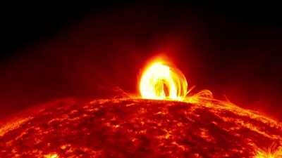 Fiery 'Coronal Rain' falling down on the sun (earth for scale after 15s)