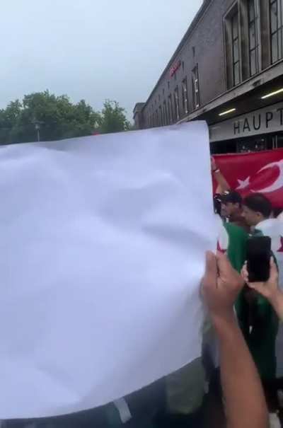 In Germany, pro-Syrian government protesters waved Syrian, Palestinian and Turkish flags at pro-SDF protesters, who displayed Kurdish, Druze, and Israeli flags.