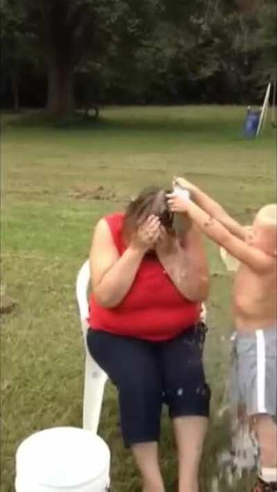 Woman gets chomped by the family dog while doing an ice bucket challenge