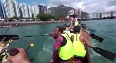 Participating in a dragon boat race.