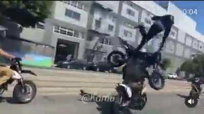 Blindly wheelie-ing down the street