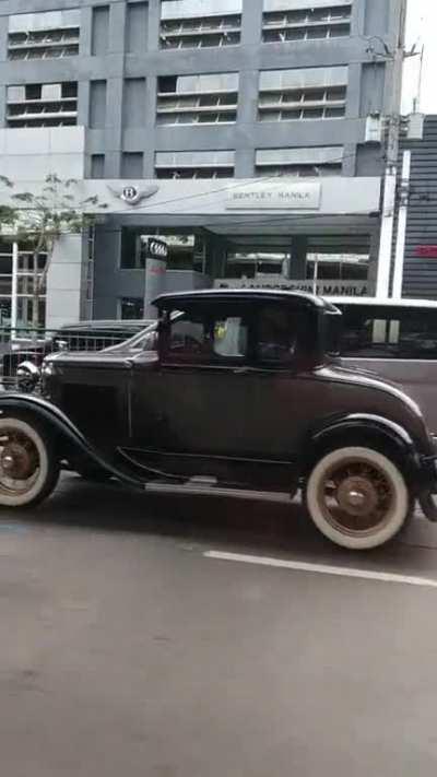 Passed by this vintage car in present day EDSA, driven by someone wearing a vintage hat.