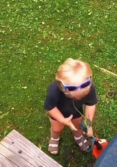 Kid perfectly imitating the sound of a lawn cutter