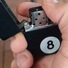 Slow motion of a lighter being turned on