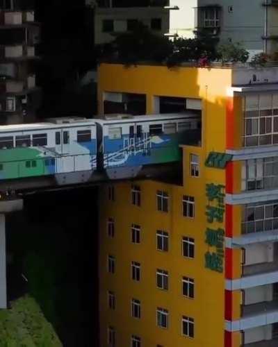 This metro in china runs through a residential apartment.