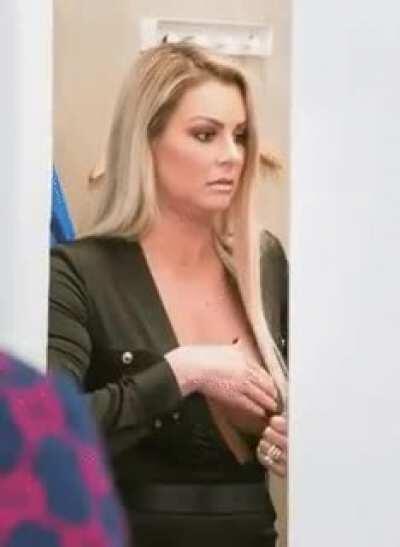 Maryse adjusting her boobs