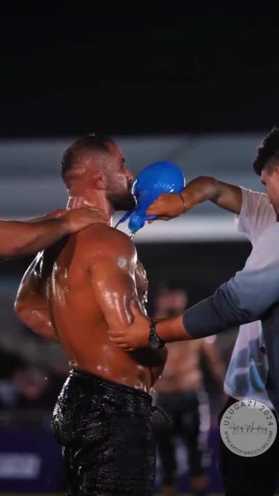 Turkish Oil wrestler getting oiled up.