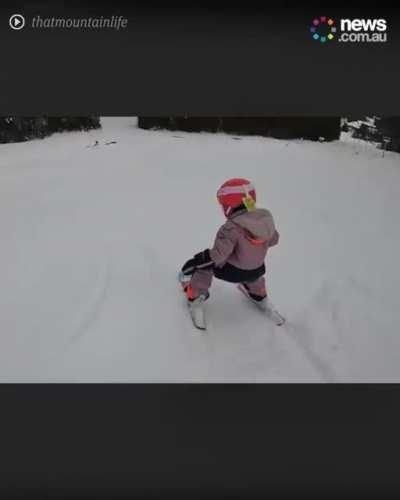 Adorable young girl and her father save their backpack.