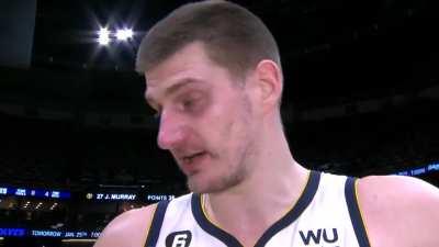 [Highlight] During his post-game interview, Nikola Jokic spots two fans making out in the crowd. 