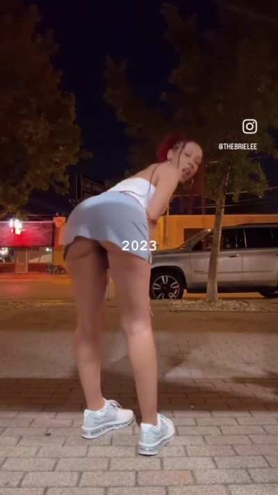 Brie bending over in skirt