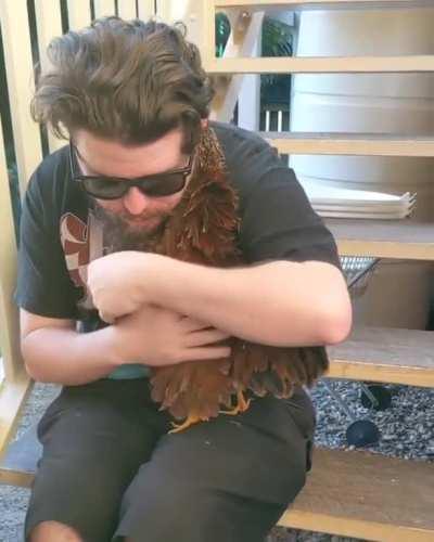 Not mine or me but dude in ghost shirt hugs chicken.