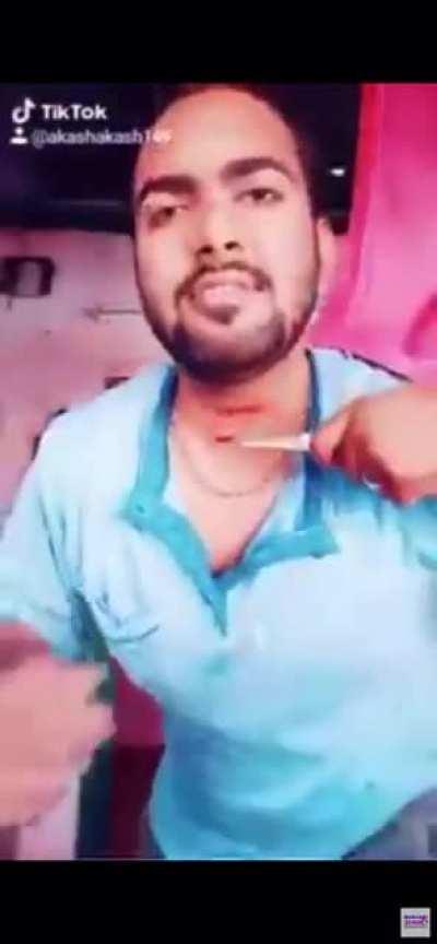 Idiot cuts his own throat filming a tik tok