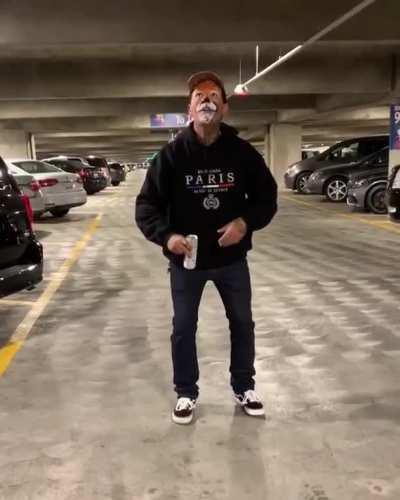 Attempting to do some sort of stunt involving a beer can...