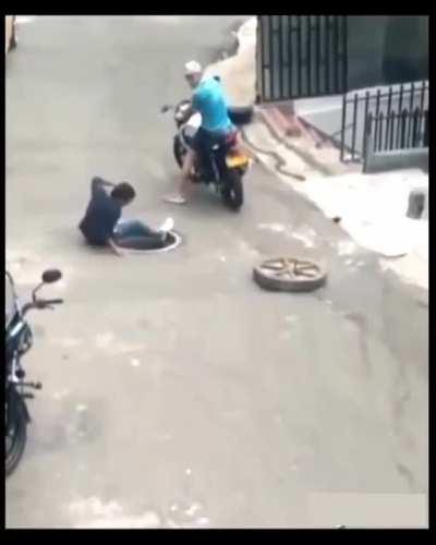 Instant karma after trying to steal a Manhole cover