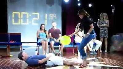 Playing a balloon-popping game on a cruise.