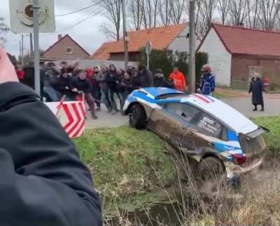 Helping out a rally car driver