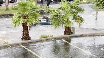 Trying to drive through a flooded wash after a monsoon.