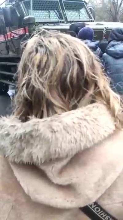 Unarmed citizens in Melitopol forming a human shield to stop an occupying Russian military convoy