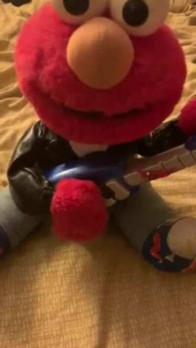 This old elmo toy I've had for almost two decades...