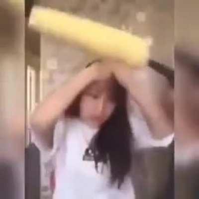 Women use a driller to eat corn but ends up bald