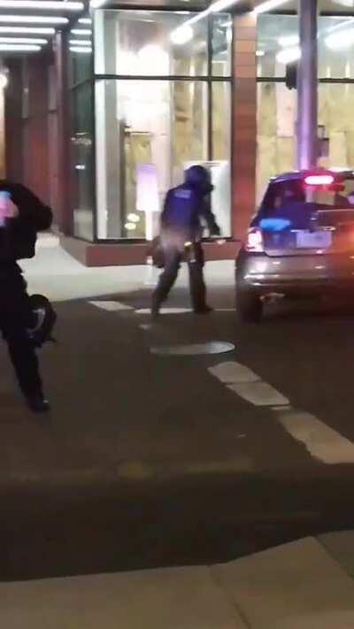 Cops spray painting on cars just because.