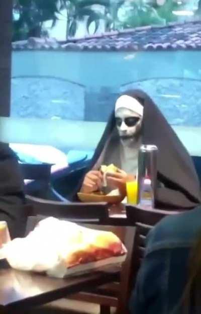 to take a sip of the juice while maintaining eye contact