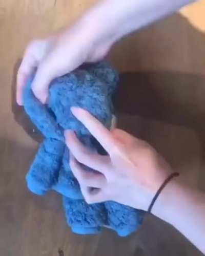 Making a teddy bear out of a wash cloth/towel.