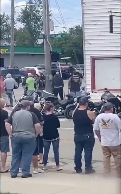 A lone young woman protests with a BLM sign while overgrown men scream in her face. Later on, her sign is torn away & she is assaulted. No protest is too small when calling out injustice.