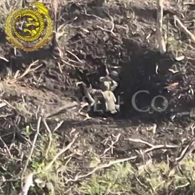 Two Russian soldiers taken out by Frag Grenade while sitting a foxhole. Shown by 《Chosen》Company. Ukraine, 2023.