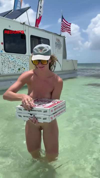 Picking up a fresh pizza from a boat in Key West