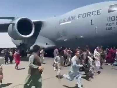 Kabul airport right now! Several people were thrown out of plane mid air.