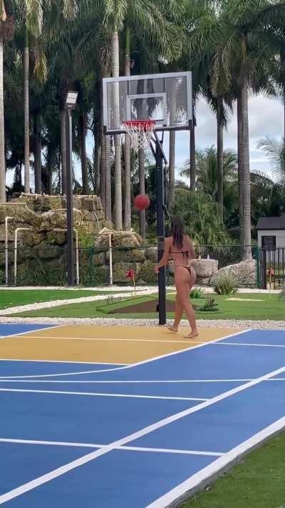 Playing basketball in bikini 