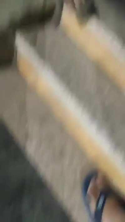 Trying to slide through the closing shutter door...