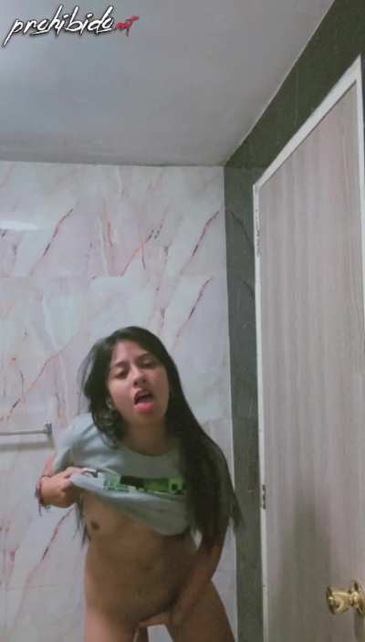 Latina girl gets horny naked in the bathroom