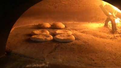 Pitot (plural for pita) rising in the oven!