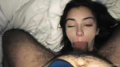 Hottie gets her face fucked while laying on her back