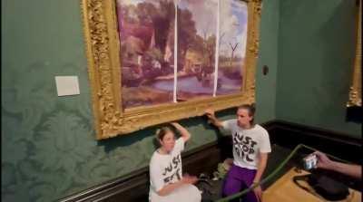 The climate activists who superglue themselves to things are at it again. This time they're glued to a painting.