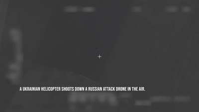 The Ukrainian military hunts a Russian drone from a helicopter.