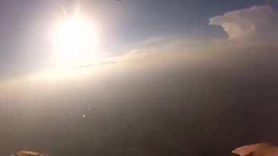 Two skydivers collide mid-air, knocking one of them unconscious. Camera man proceeds to pull some mission impossible shit and saves his life.