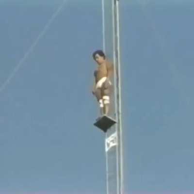 In 1983, Bruce Boccia made an attempt to tie the world record for high dive at Sea World in San Diego. You can see him here, attempting to jump from a height of 172 ft (52.4 m). The woman on the left is his mom, watching nervously.