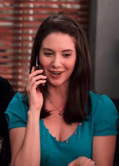 Annie using her phone as a phone