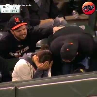 Fan scoops up a ball that's still in play