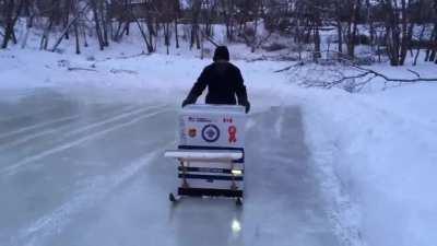 Building our river ice rink with the new DIY Zamboni! It’s scrubbing the ice clean. Some Winnipeg ingenuity at its finest!