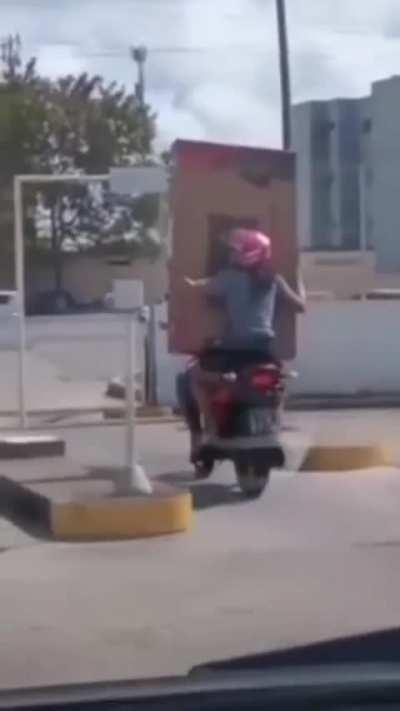 Blindly carrying a bulky package and not thinking about clearance