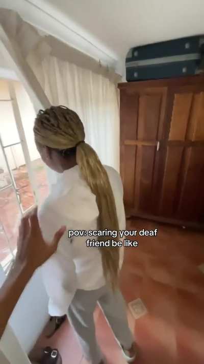 Scaring their deaf friend