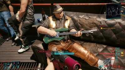 Random NPC is playing ACTUAL GUITAR. The notes are perfect and on time and his picking had is also the best I've ever seen in a videogame. As a guitarist, this makes me oddly happy and amazed. Just wow.
