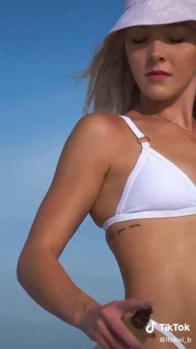 Rubbing oil on herself